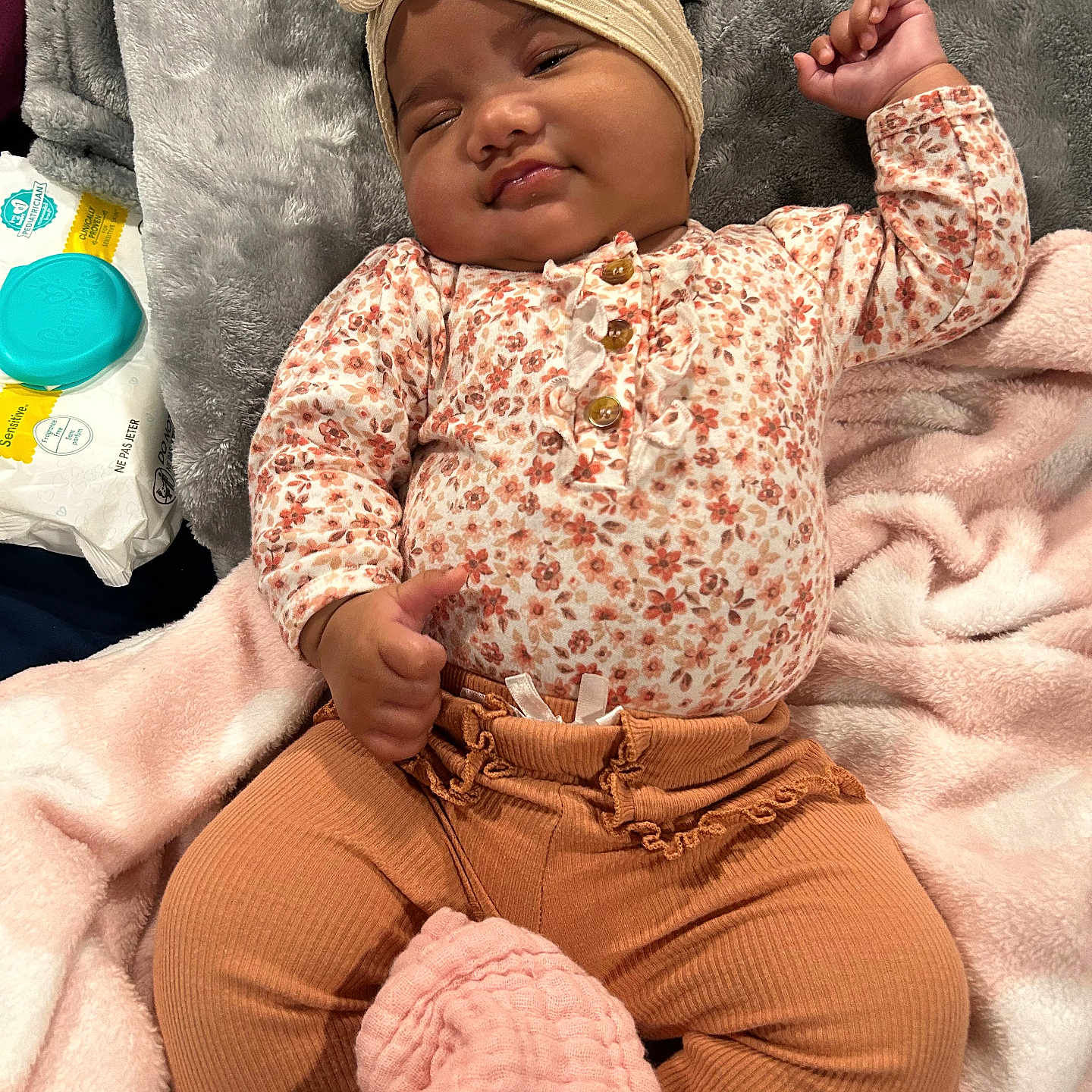 Ariana is registered to the contest to win money with this photo: baby, bed, blanket, bodypart, clothing, face, finger, furniture, hand, happy, hat, head, newborn, pants, person, photography, portrait, quilt, sleeping, smile