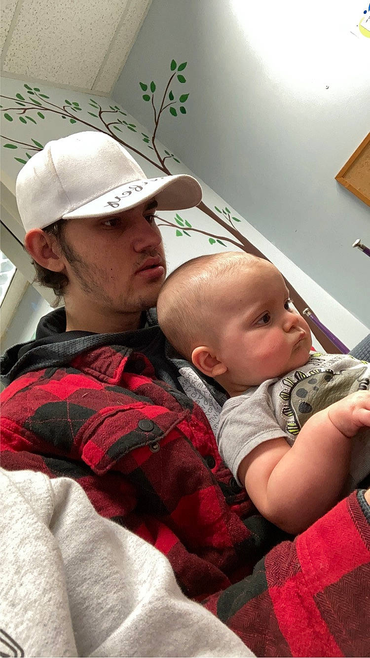 Christopher joined the competition — help win amazing prizes! baby, baseball_cap, cap, carmine, child, comfort, couch, event, fun, hairstyle, happy, hat, headgear, headwear, pattern, person, plaid, plant, room, sitting