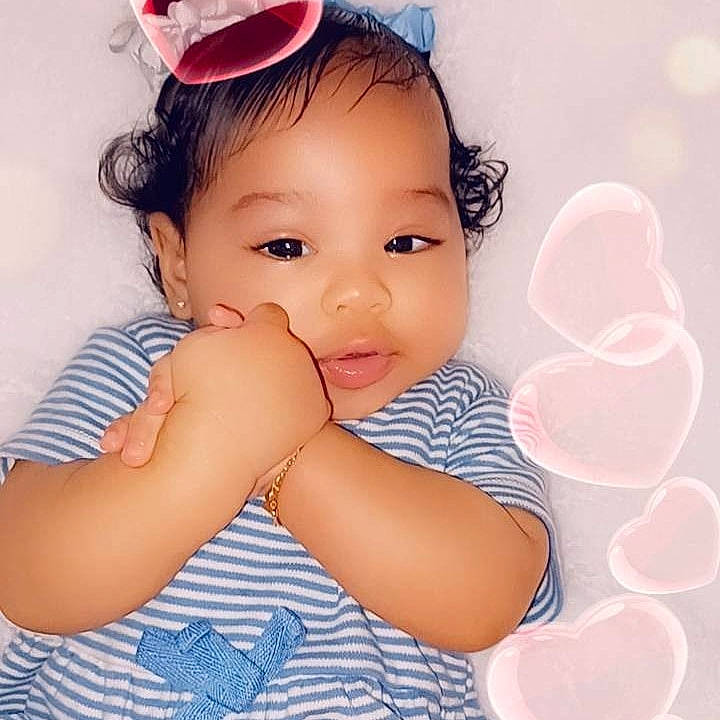 Nye is registered to the contest to win money with this photo: arm, baby_toddler_clothing, black_hair, cheek, ear, eyebrow, eyelash, finger, flash_photography, fun, gesture, happy, iris, lip, neck, nose, person, pink, skin, thumb