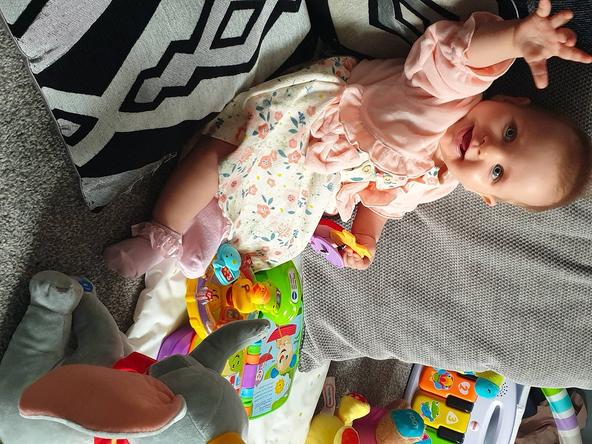 Leona joined the competition — help win amazing prizes! baby, baby_products, baby_toddler_clothing, cheek, child, comfort, dress, fun, grass, happy, human_body, joy, linens, pattern, person, product, sitting, sleeve, textile, thigh