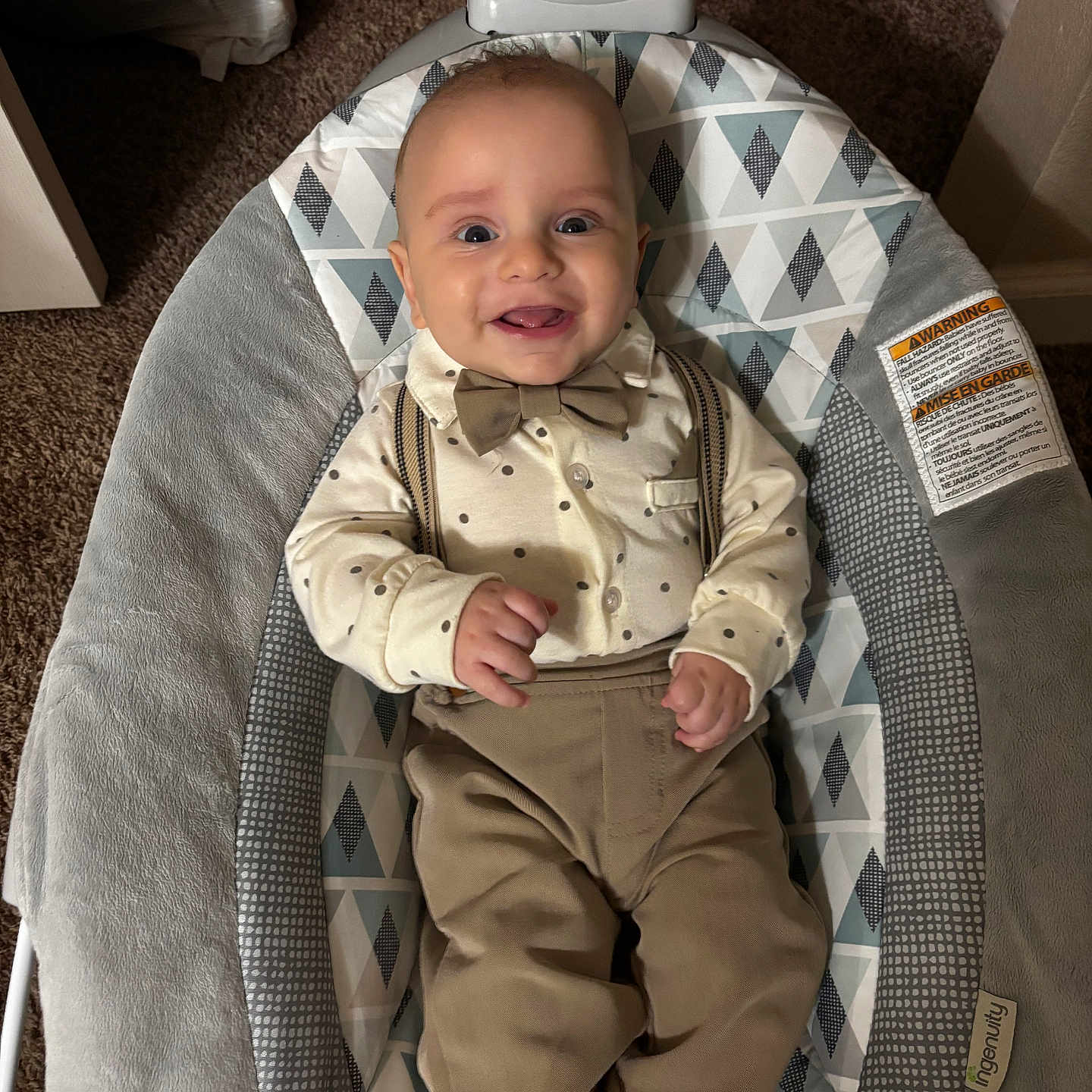 Gabriel joined the competition — help win amazing prizes! baby, baby_seat, baby_toys, bow_tie, carpet, child, clothing, comfort, cute, face, furniture, happy, indoor, infant, infant_clothing, pattern, person, portrait, smiling, suspenders