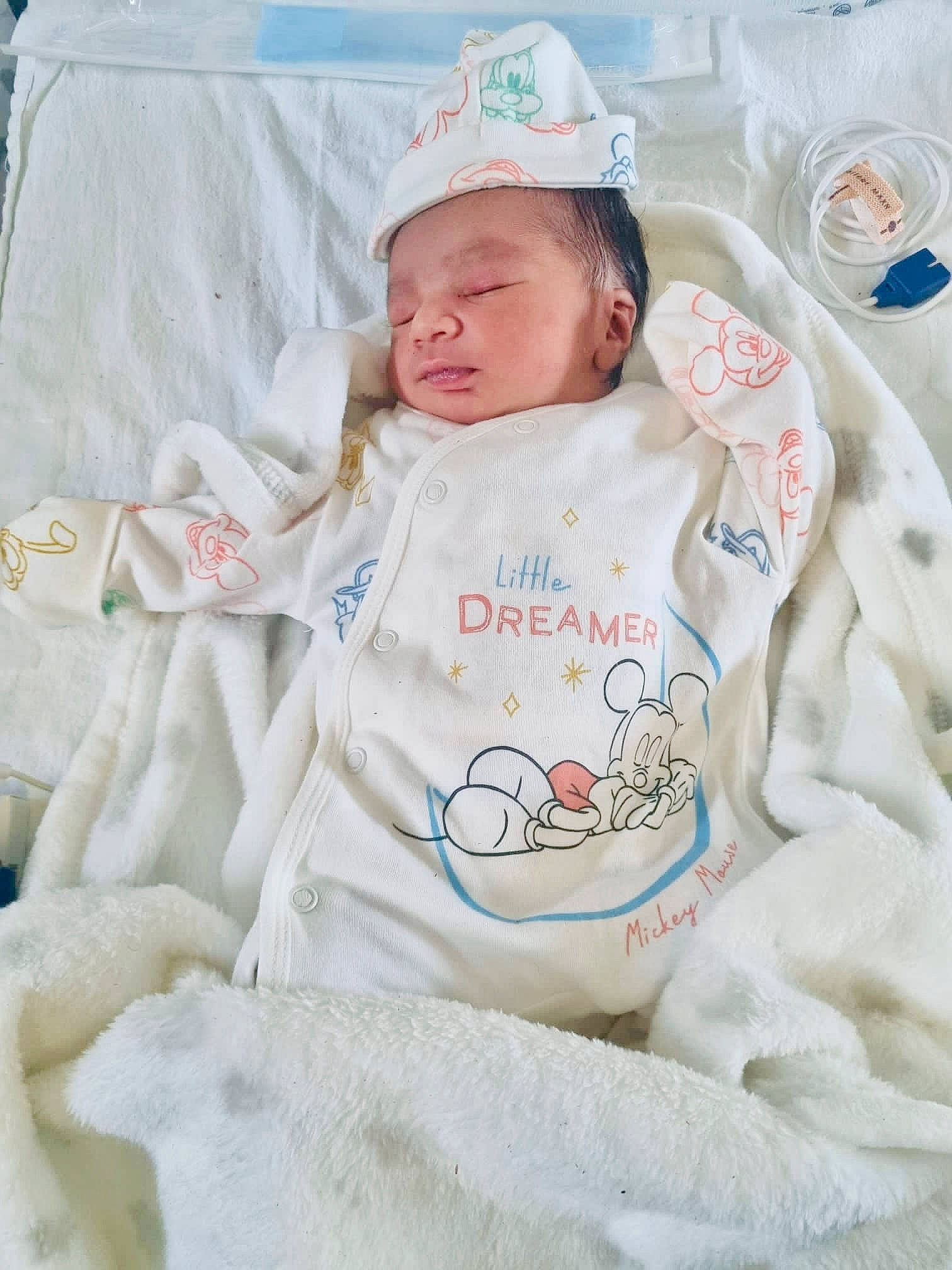 Ryan joined the competition — help win amazing prizes! baby, baby_products, baby_safety, baby_sleeping, baby_toddler_clothing, baseball_cap, bedding, cap, child, comfort, face, hat, linens, person, room, sitting, sleeve, toddler