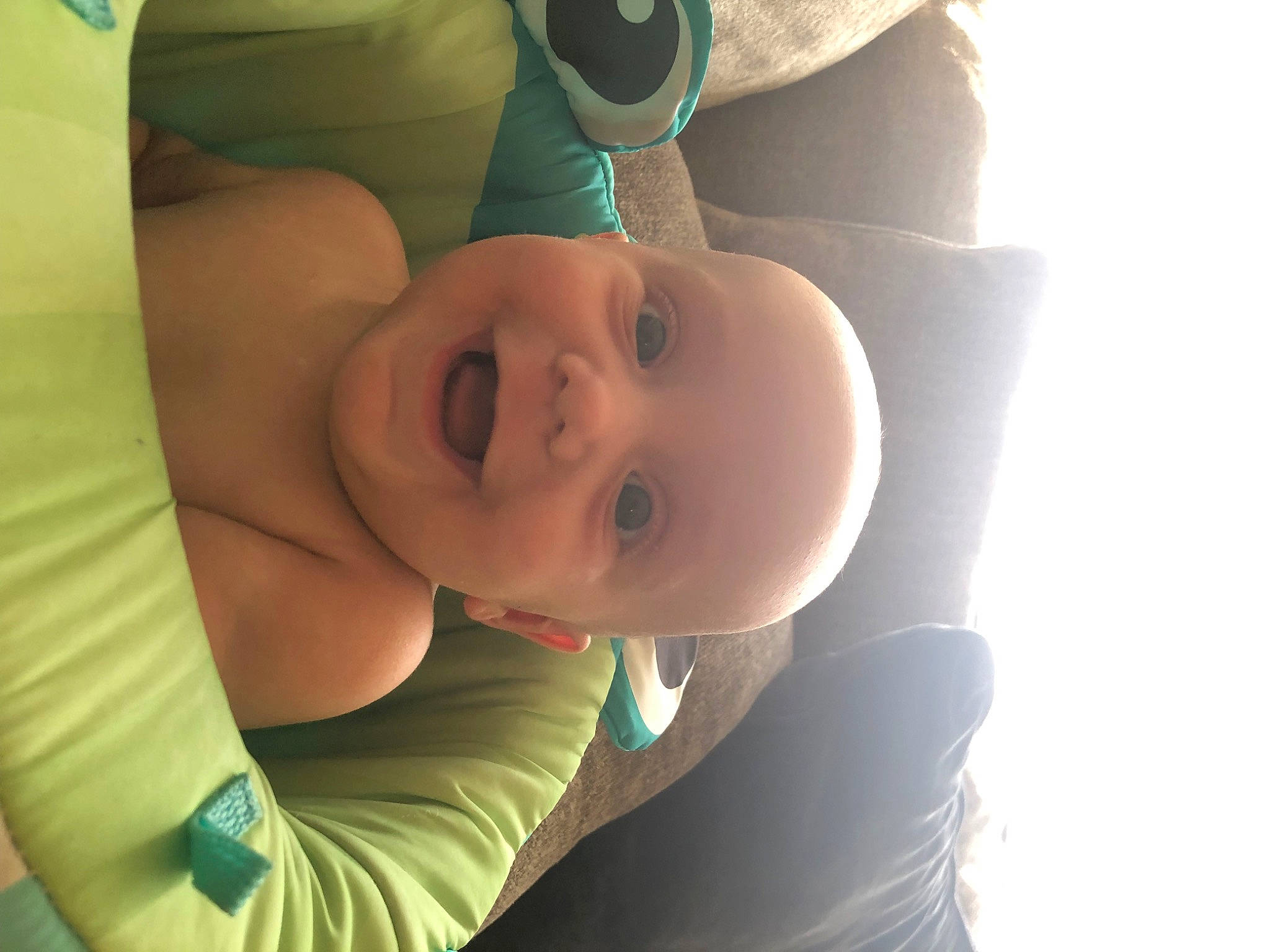 Kenneth is registered to the contest to win money with this photo: baby, comfort, elbow, eyebrow, eyelash, fun, gesture, grass, happy, hat, joy, leisure, lip, mouth, neck, person, skin, smile, sun_hat, toddler