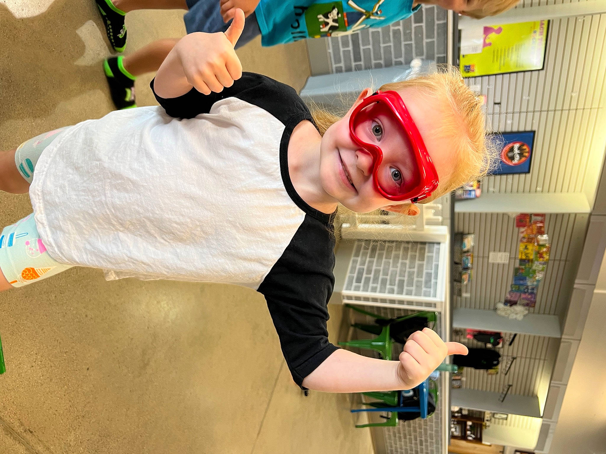 Rae is registered to the contest to win money with this photo: chef, cook, cooking, event, eyewear, fun, happy, home_appliance, homemaker, joy, kitchen, kitchen_appliance, machine, major_appliance, microwave_oven, person, personal_protective_equipment, refrigerator, room, service