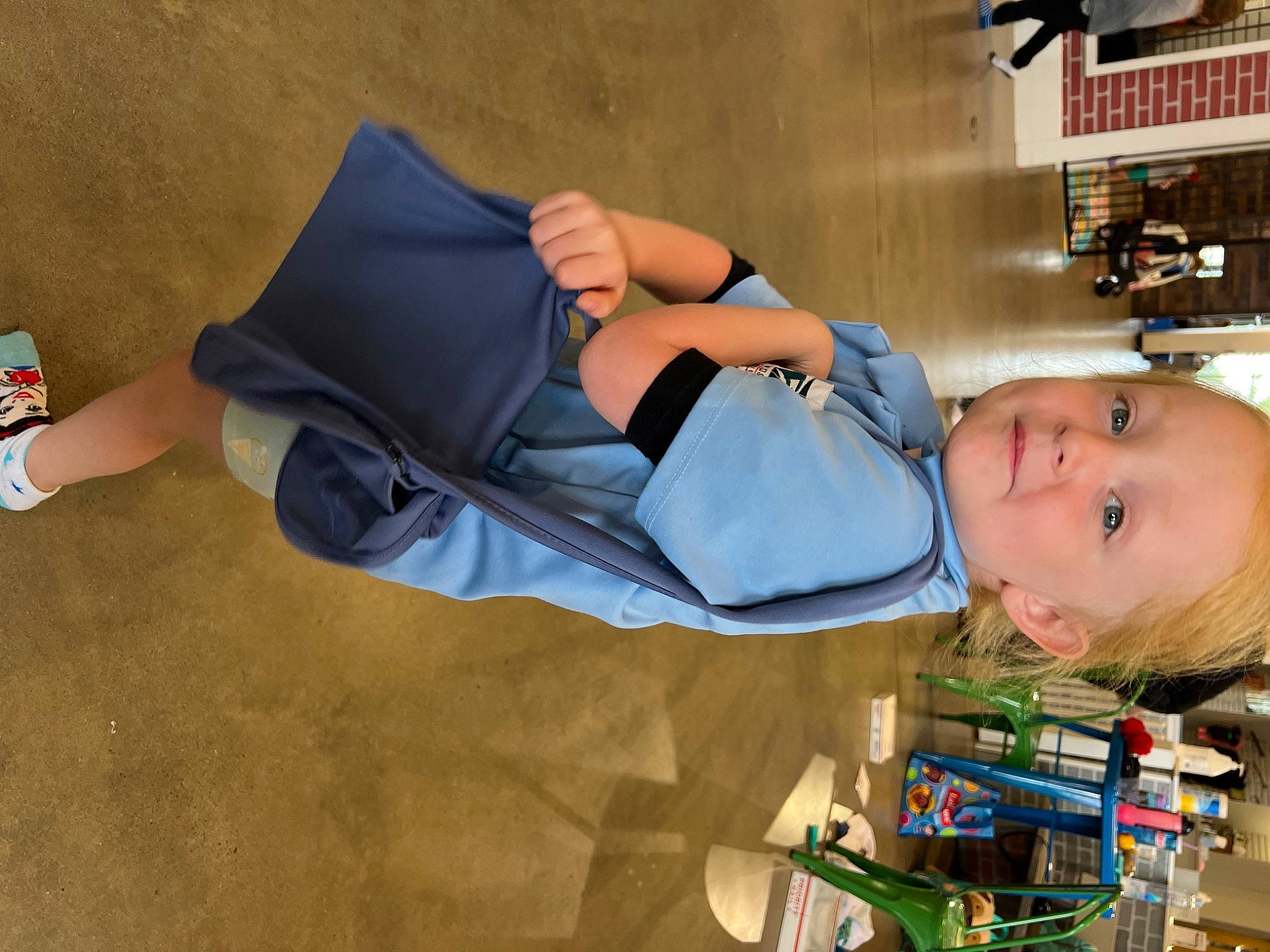 Rae joined the competition — help win amazing prizes! baby, comfort, elbow, eyewear, finger, foot, fun, hat, human_leg, knee, leg, leisure, person, room, shelf, shorts, sitting, sportswear, thigh, toddler