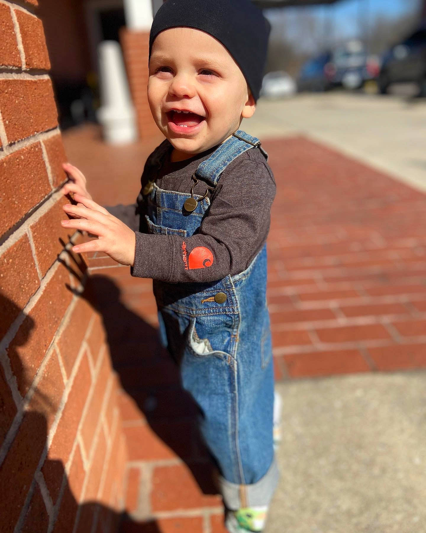Leevi joined the competition — help win amazing prizes! baby, baby_toddler_clothing, brick, brickwork, cap, child, denim, electric_blue, fun, happy, hat, headwear, leisure, orange, outerwear, person, photograph, sleeve, smile, standing