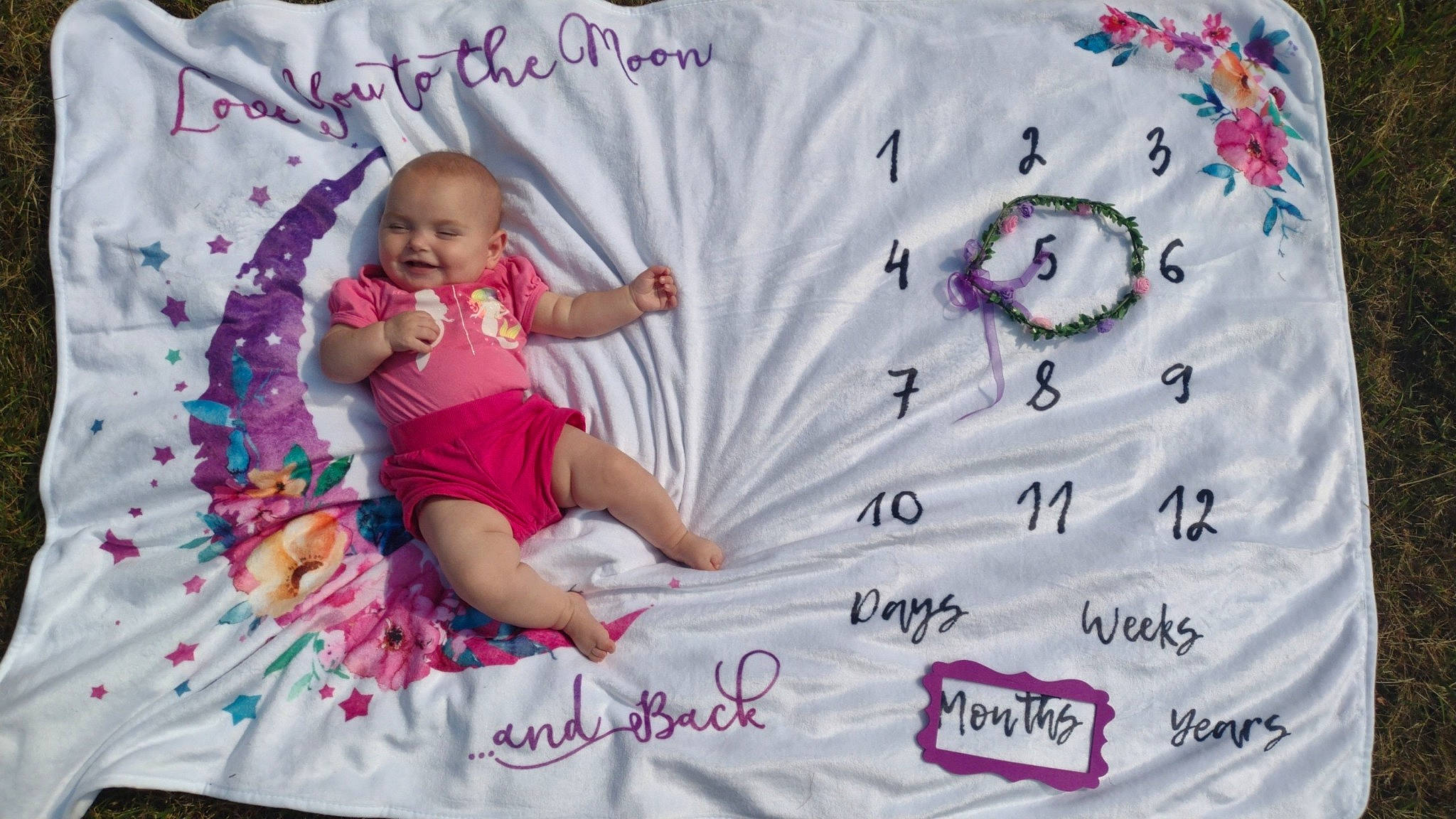 Emory is registered to the contest to win money with this photo: baby, baby_toddler_clothing, beauty, child, design, event, facial_expression, font, happy, joy, linens, magenta, pattern, person, pink, product, purple, sleeve, t_shirt, textile
