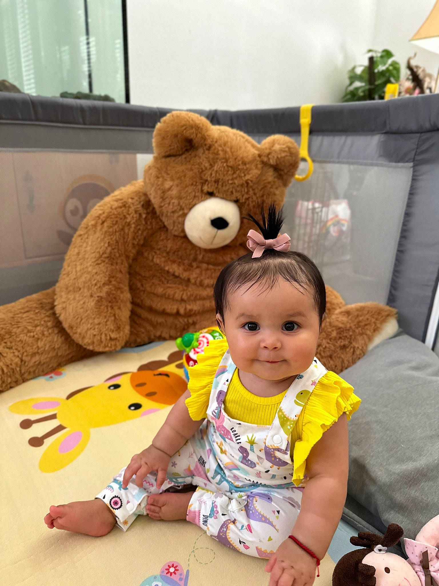 Amanda is registered to the contest to win money with this photo: baby, baby_toddler_clothing, comfort, couch, fun, happy, head, mammal, person, photograph, plant, room, skin, snapshot, stuffed_toy, teddy_bear, textile, toddler, toy, vertebrate