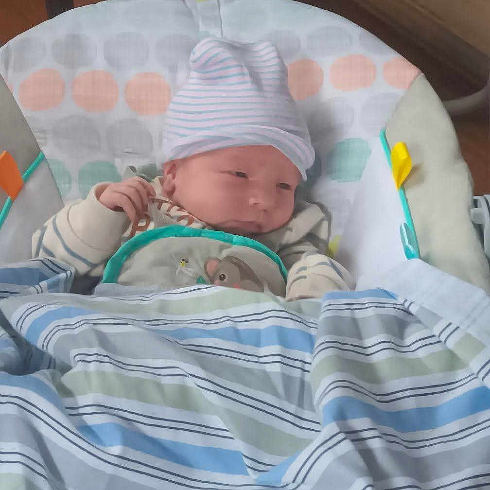 Jordan joined the competition — help win amazing prizes! newborn, baby, infant, blanket, hat, striped, baby_seat, cushion, polka_dot, sleepwear, cozy, indoors, child, face, clothing, resting, cute, soft, striped_blanket, young