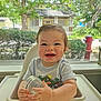 Finn joined the competition — help win amazing prizes! baby, high_chair, smiling, indoor, window, cup, child, happy, toddler, face, hands, clothing, greenery, tree, house, daylight, person, cute, infant, home
