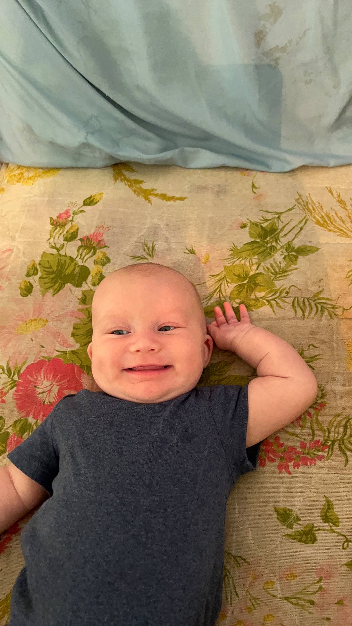 Payden is registered to the contest to win money with this photo: baby, baby_toddler_clothing, cheek, child, fun, grass, happy, joy, leaf, linens, pattern, person, plant, portrait_photography, room, sitting, skin, sleeve, smile, textile