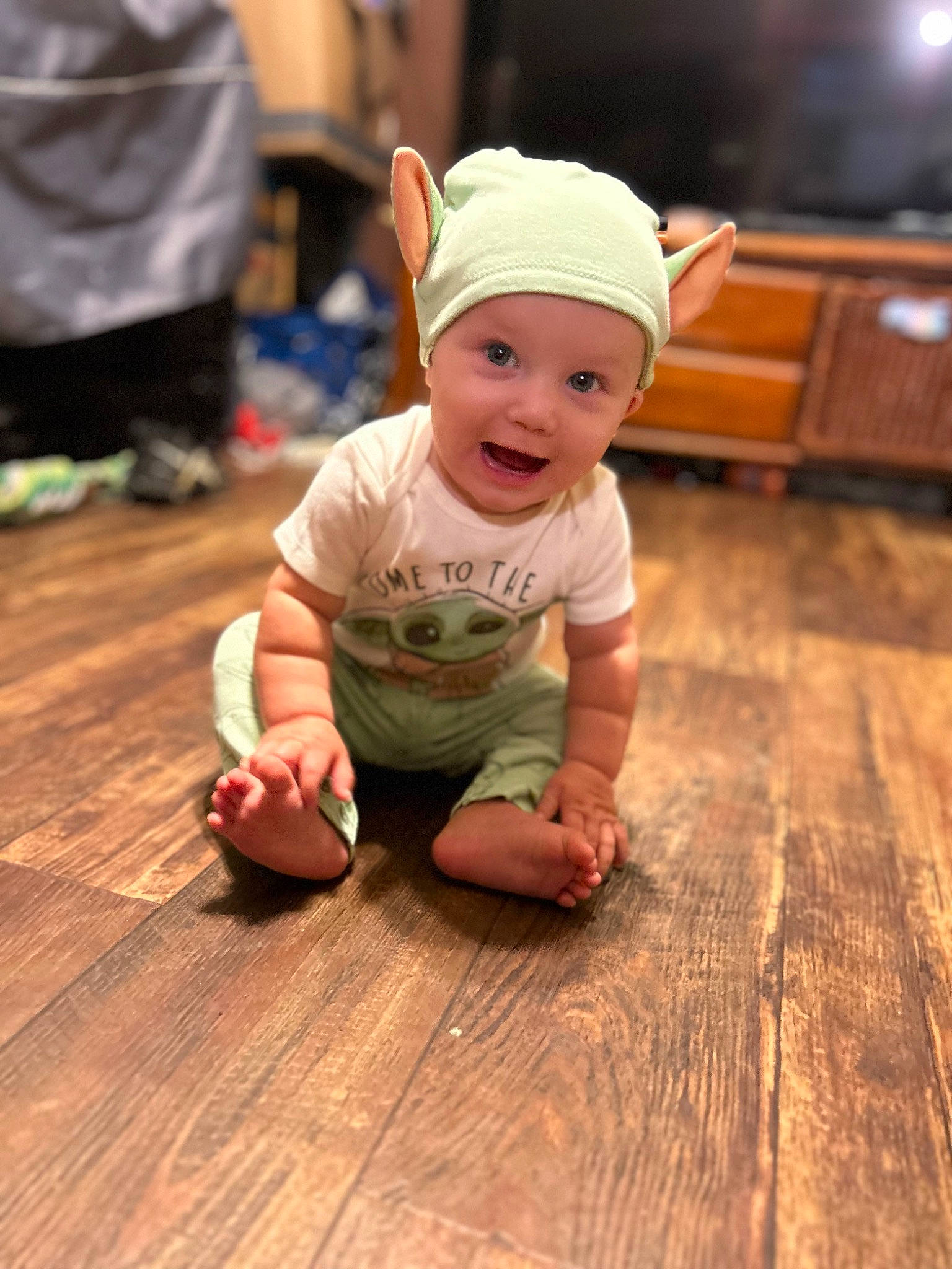 Payden is registered to the contest to win money with this photo: baby, baby_toddler_clothing, cap, floor, flooring, fun, grass, happy, hardwood, hat, headwear, joy, laminate_flooring, person, plank, sitting, skin, smile, toddler, varnish