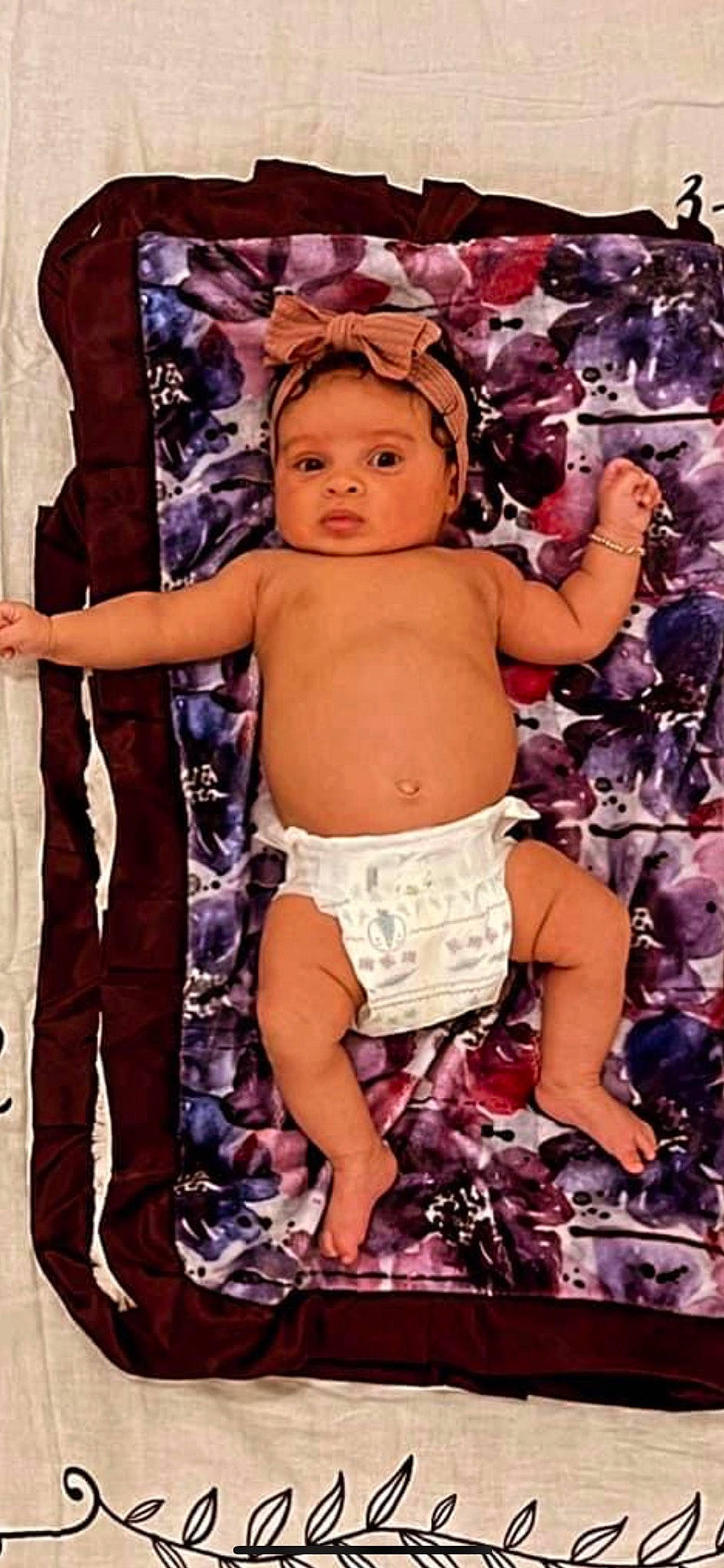 Faye is registered to the contest to win money with this photo: abdomen, baby, baby_toddler_clothing, barechested, chest, child, diaper, fashion_accessory, fun, happy, muscle, navel, pattern, people_in_nature, person, pink, purple, shorts, thigh, toddler
