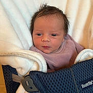 Judith participe au concours pour gagner de l'argent avec cette photo : baby, baby_carrier, blanket, closeup, clothing, cozy, cute, face, head, human, indoors, infant, newborn, person, portrait, skin, sleepy, soft_texture, wrapped, young_child