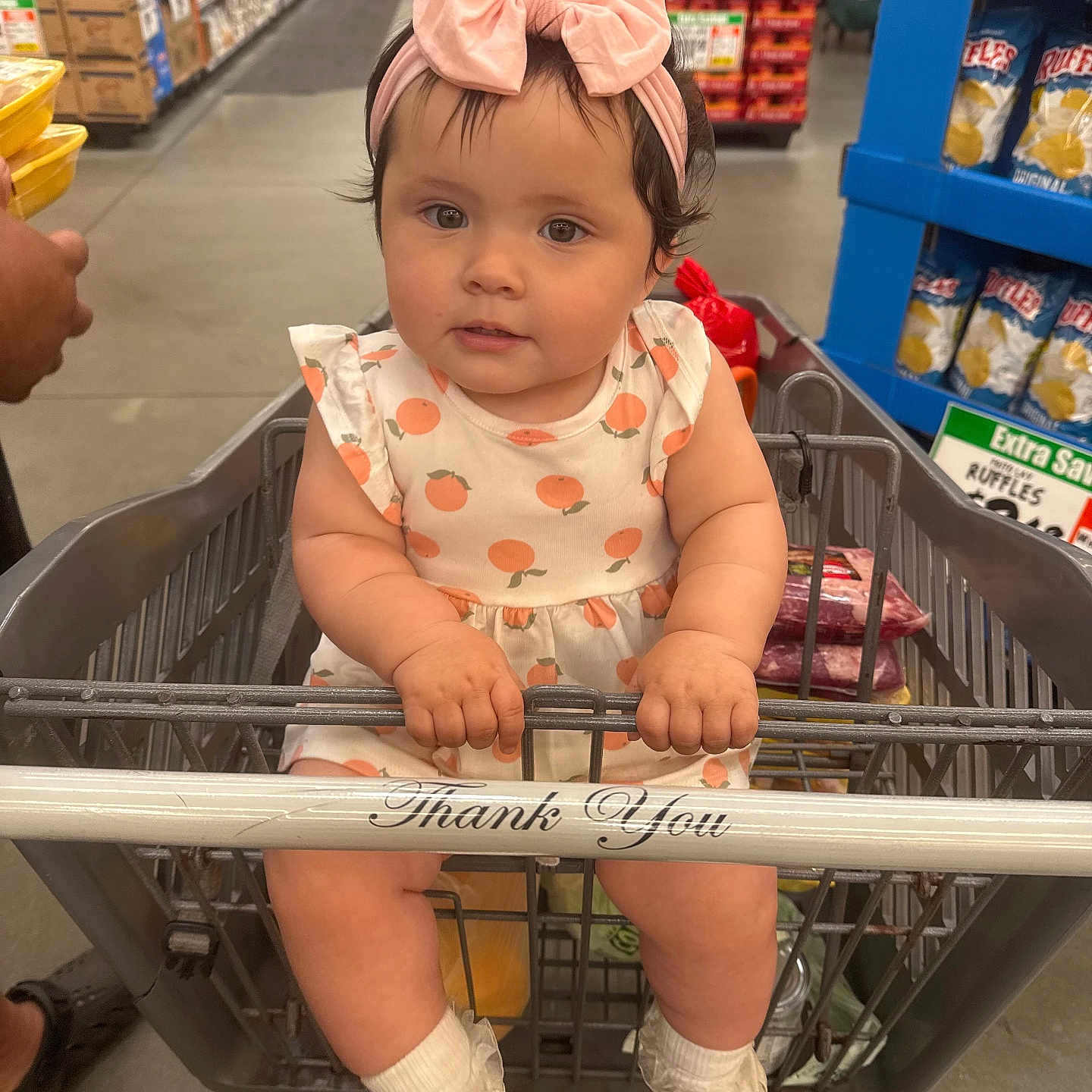 Sonia joined the competition — help win amazing prizes! baby, child, shopping_cart, grocery_store, headband, pink_bow, dress, peach_pattern, white_shoes, socks, person, aisle, products, supermarket, shopping, floor, hand, grip, cute, portrait