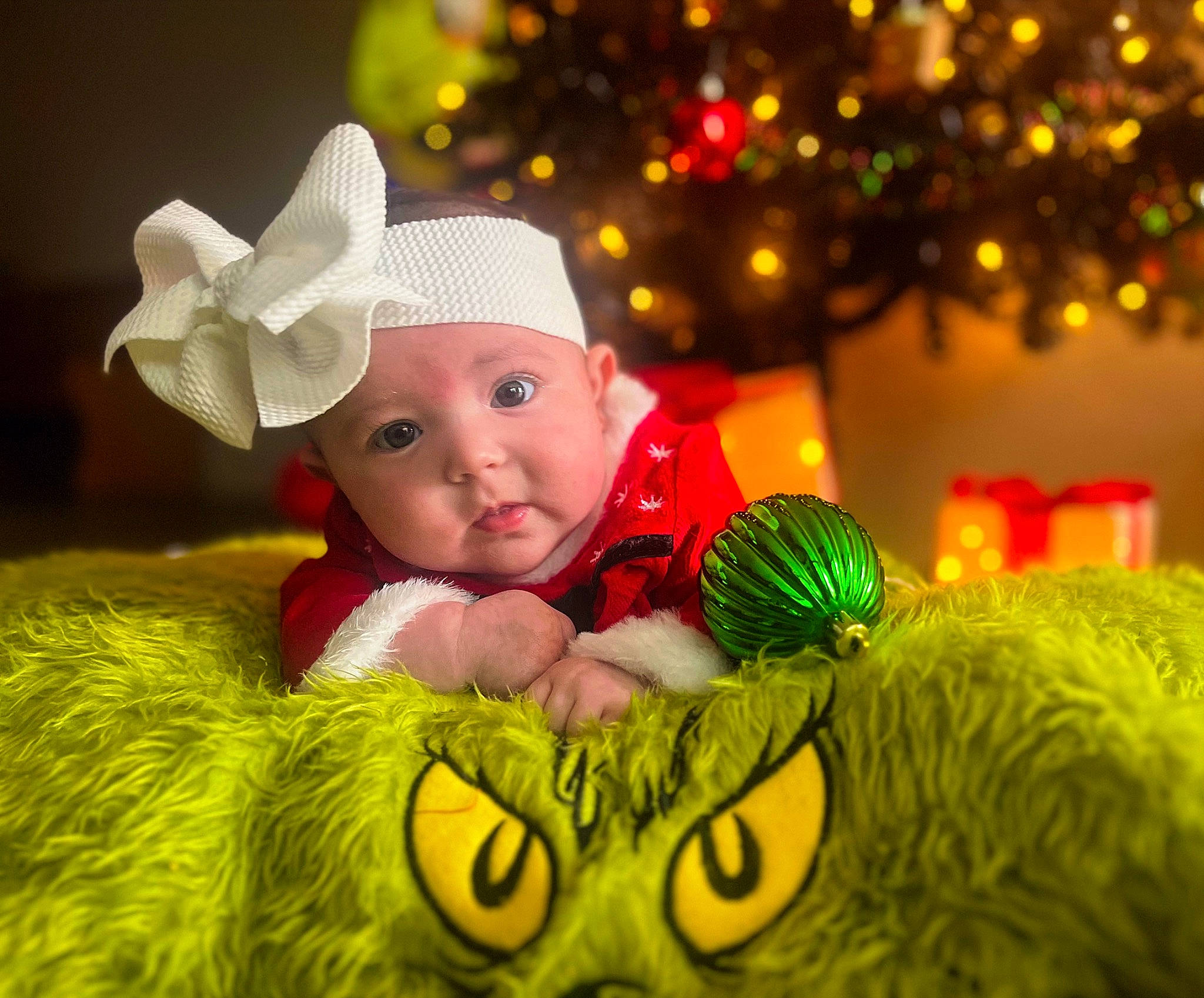 Saylor joined the competition — help win amazing prizes! baby, baby_toddler_clothing, child, christmas, christmas_decoration, christmas_eve, christmas_ornament, christmas_tree, costume_hat, event, fictional_character, fun, grass, happy, headwear, holiday, light, ornament, people_in_nature, person