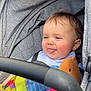 baby, casual, child, child_seat, childcare, colorful_toy, comfort, cute, gray_fabric, happy, infant, playful, plush_toy, portrait, rosy_cheeks, seatbelt, smiling, soft_lighting, stroller, tongue_out