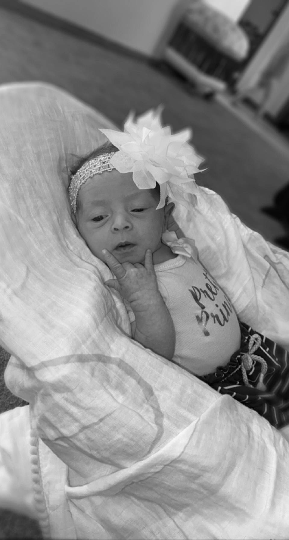 Axel is registered to the contest to win money with this photo: baby, black_and_white, bridal_accessory, bridal_clothing, bridal_veil, dress, event, fashion_accessory, flash_photography, gesture, happy, headband, headpiece, monochrome, monochrome_photography, person, petal, style, toddler, veil