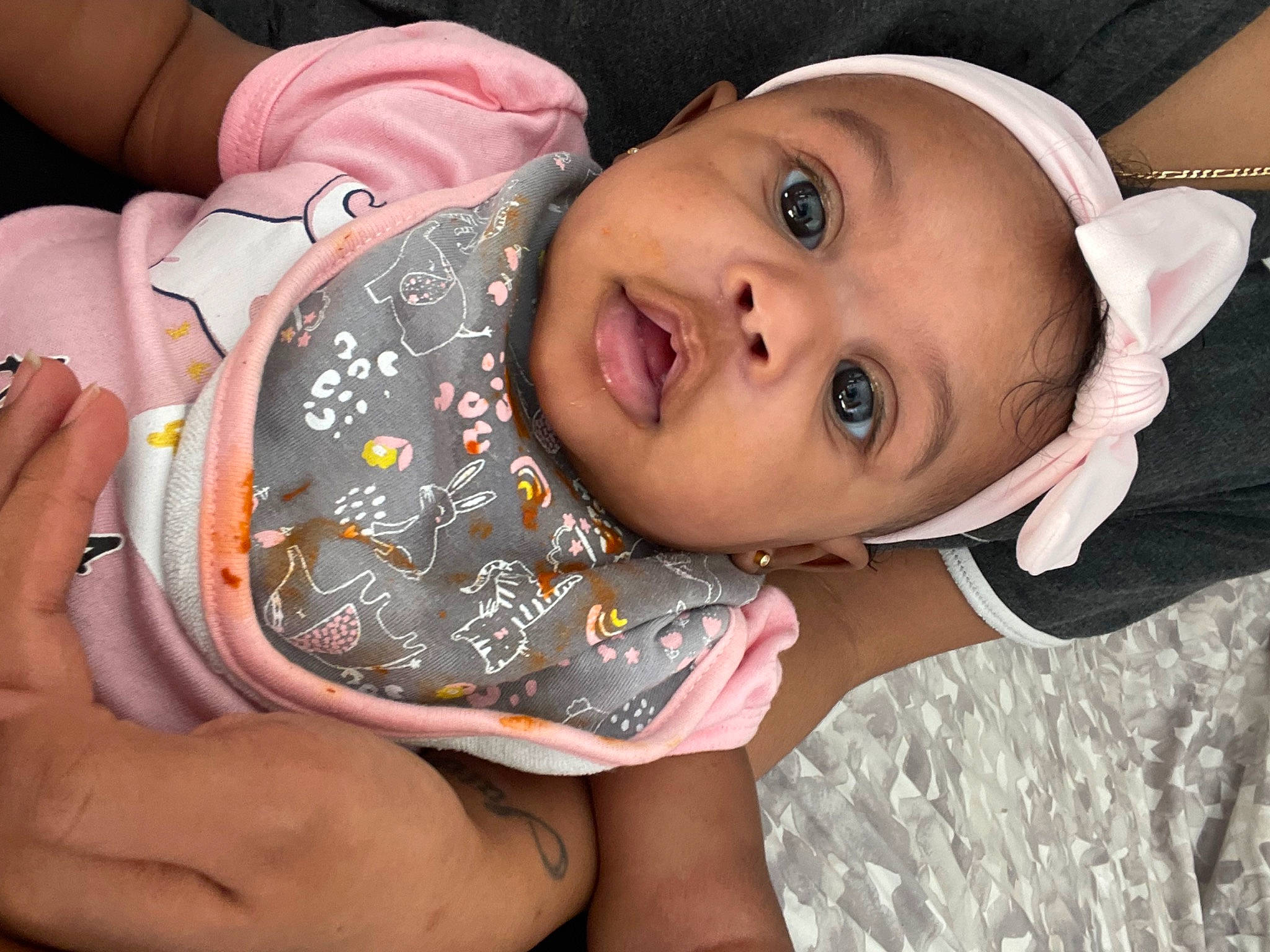 Amarie is registered to the contest to win money with this photo: arm, baby_toddler_clothing, cheek, chin, eye, eyebrow, eyelash, face, gesture, happy, hat, head, human_body, iris, lip, mouth, neck, nose, person, skin