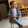 Adriano a rejoint le concours — aidez-le/la à gagner de superbes lots ! casual_clothing, child, crossed_legs, daylight, denim_jacket, happy, holding_object, home_interior, indoor, jeans, portrait, short_hair, sitting, smiling, tile_floor, tool, white_shoes, wooden_chair, wooden_chairs, young_boy