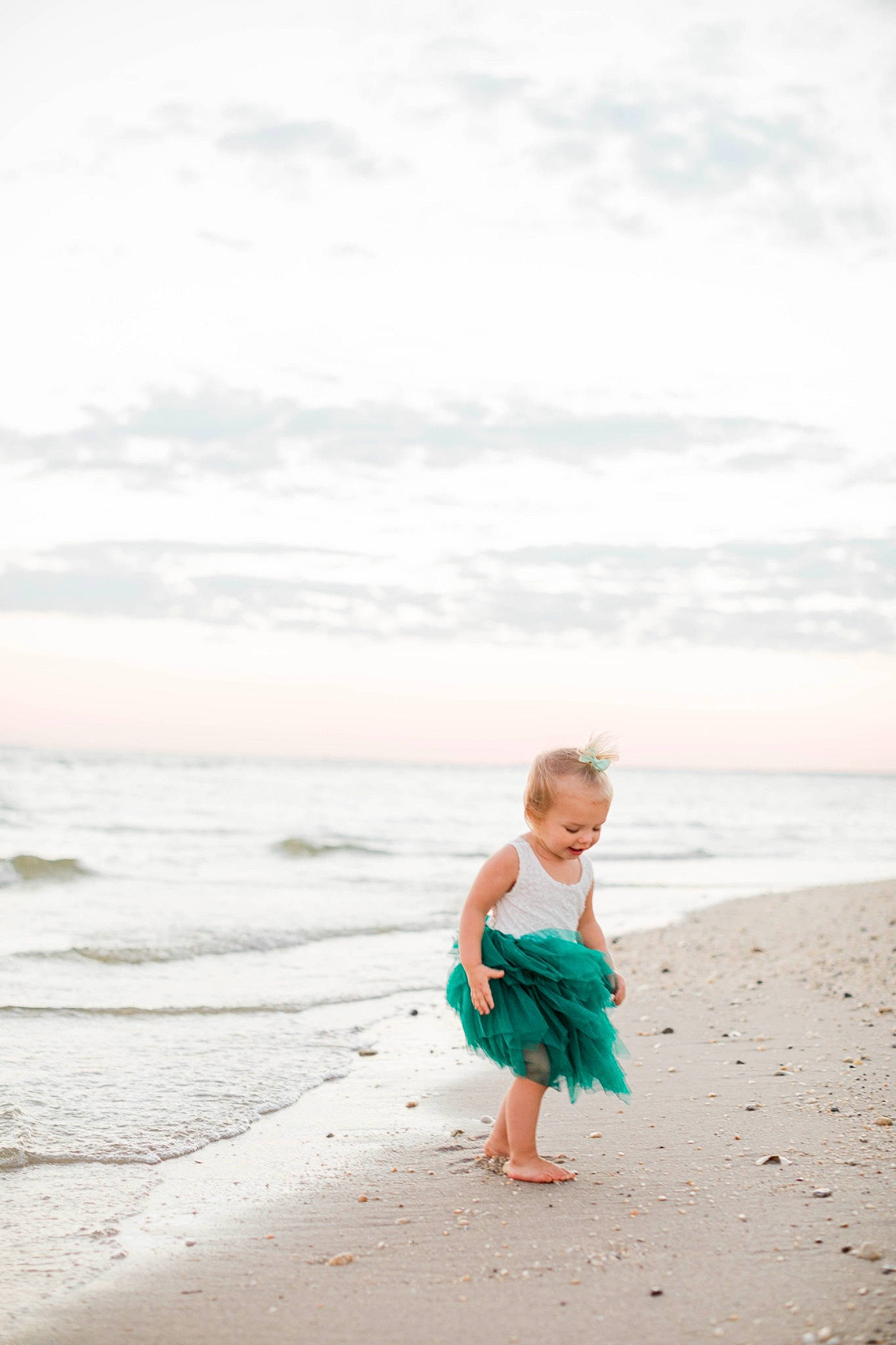 Scarlett is registered to the contest to win money with this photo: barefoot, beach, calm, cloud, coastal_and_oceanic_landforms, dress, flash_photography, happy, horizon, landscape, leisure, people_in_nature, people_on_beach, person, sand, sky, t_shirt, toddler, travel, water