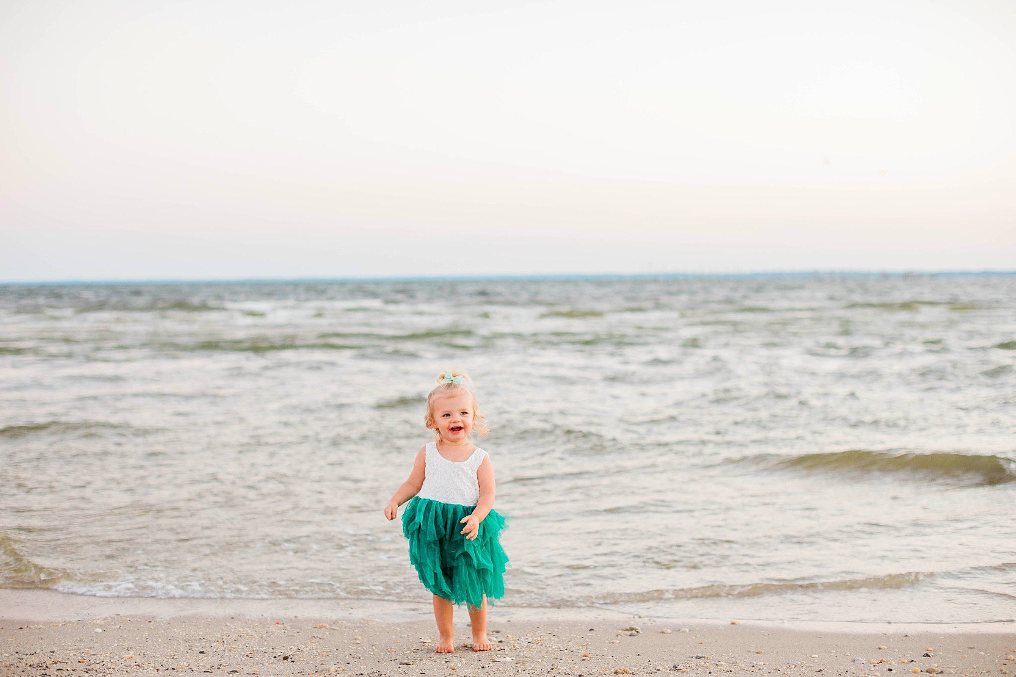 Scarlett is registered to the contest to win money with this photo: barefoot, beach, calm, coastal_and_oceanic_landforms, dress, event, fun, gesture, happy, horizon, landscape, leisure, people_in_nature, people_on_beach, person, shore, sky, travel, waist, water
