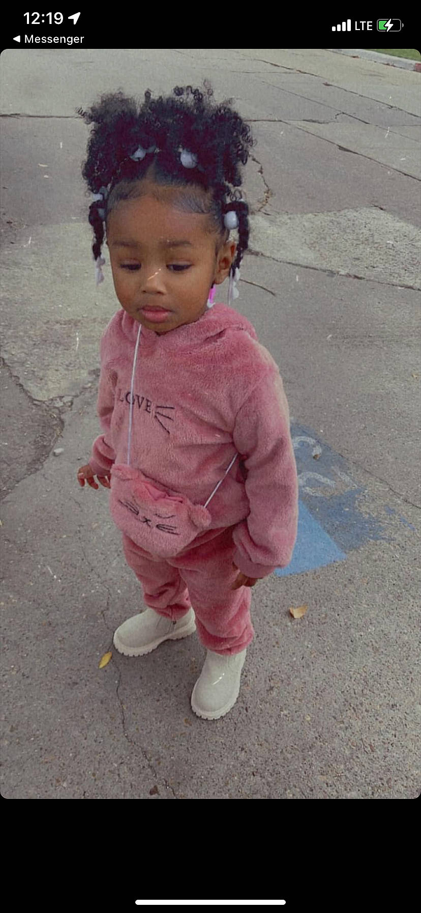 Monie is registered to the contest to win money with this photo: asphalt, baby, baby_toddler_clothing, cheek, child, chin, eye, face, hair, happy, head, lip, magenta, nose, person, pink, road_surface, skin, sleeve, smile