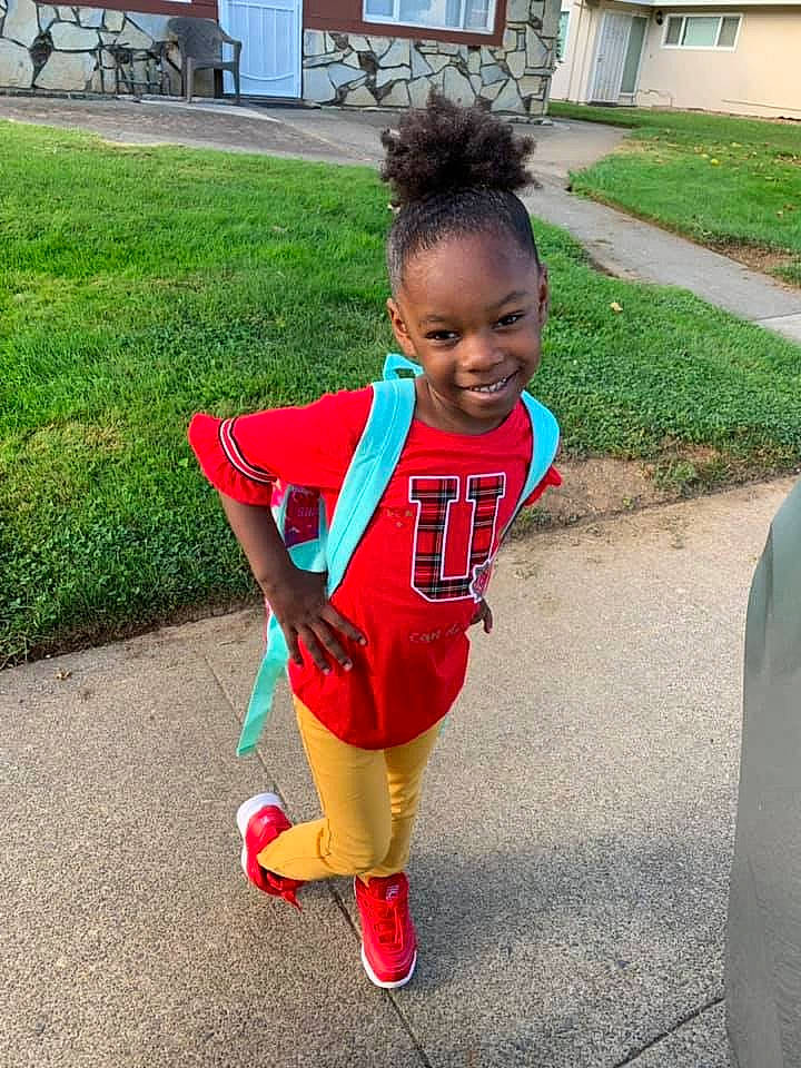 Kamia Smith is registered to the contest to win money with this photo: child, footwear, joy, leg, person, plant, play, recreation, red, shoe, smile, summer, toddler, vacation