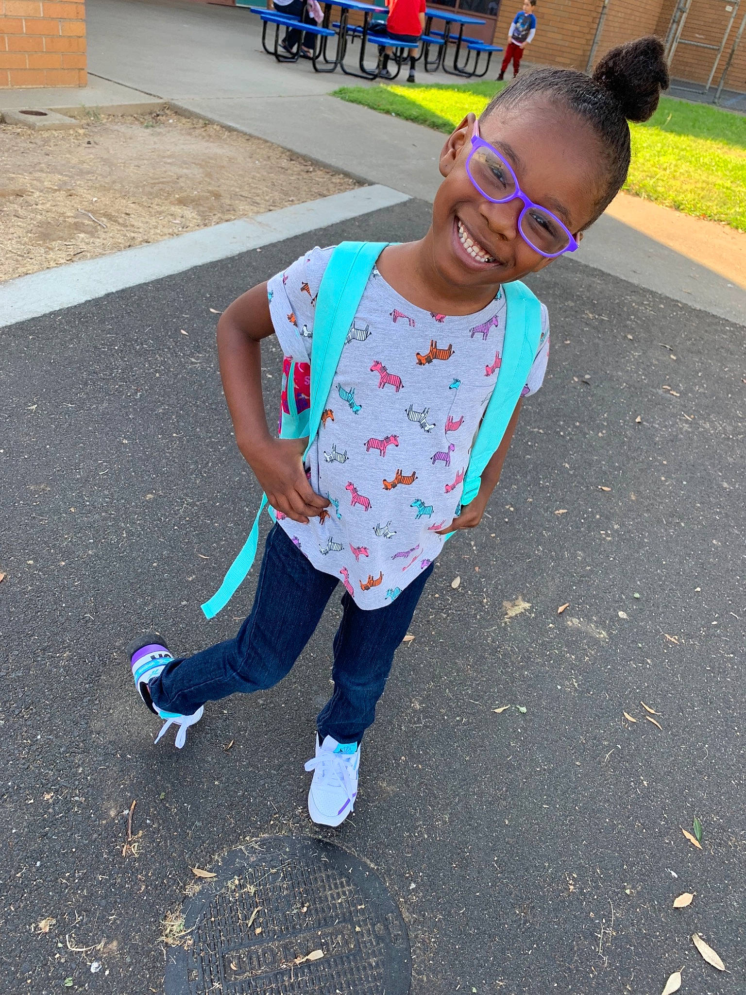 Kamia Smith is registered to the contest to win money with this photo: asphalt, child, cool, eyewear, footwear, fun, glasses, hairstyle, head, joy, people, person, play, public_space, recreation, shoe, smile, summer, sunglasses, t_shirt