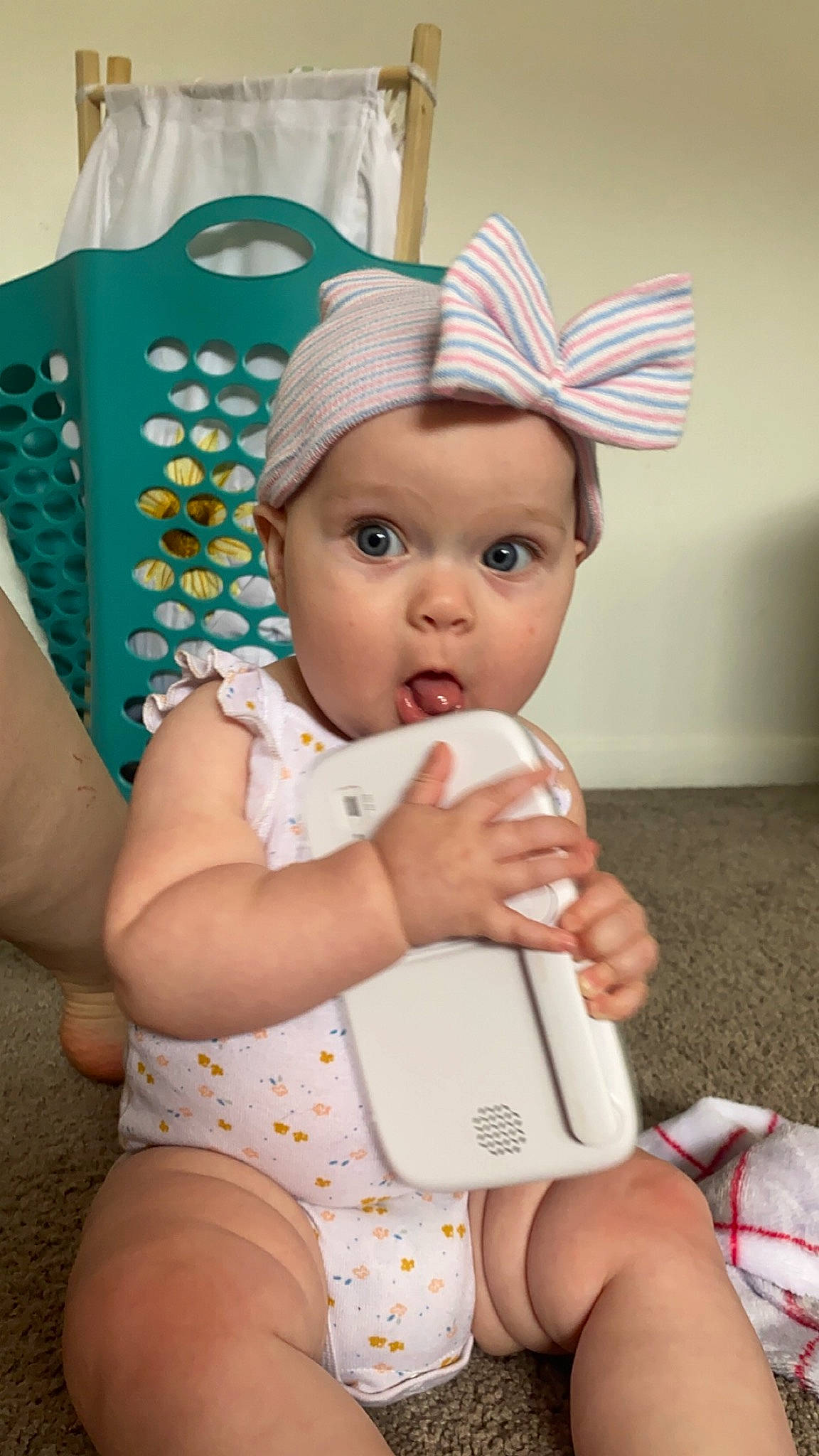 Braelynn is registered to the contest to win money with this photo: baby, baby_toddler_clothing, cap, cheek, child, costume_hat, eye, face, fashion_accessory, fun, happy, hat, headwear, human_leg, nail, person, pink, skin, sun_hat, surprise