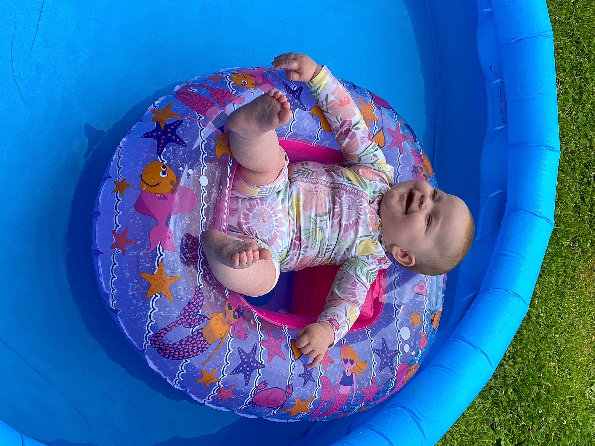 Braelynn joined the competition — help win amazing prizes! baby, baby_products, baby_toddler_clothing, bathing, blue, child, circle, comfort, electric_blue, fun, inflatable, joy, leisure, magenta, pattern, person, pink, play, product, recreation