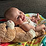 baby, baby_seat, carpet, child, clothing, colorful, comfort, couch, cute, face, happy, indoor, infant, person, plush, relaxing, skin, smiling, teddy_bear, toy