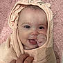 baby, blanket, child, closeup, cute, expression, face, hand, happy, indoors, infant, peach, person, pink, portrait, skin, smiling, towel, warm, wrapped