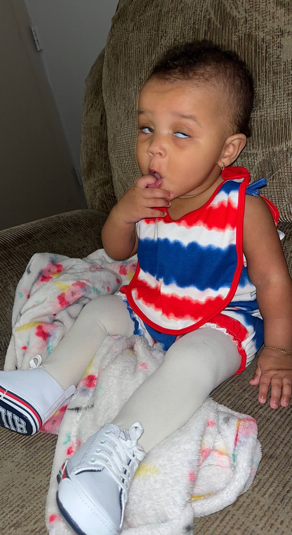 Jaylah is registered to the contest to win money with this photo: baby_toddler_clothing, cheek, face, finger, hairstyle, hand, head, human_body, joint, knee, leg, neck, person, red, skin, sleeve, sock, t_shirt, textile, thigh