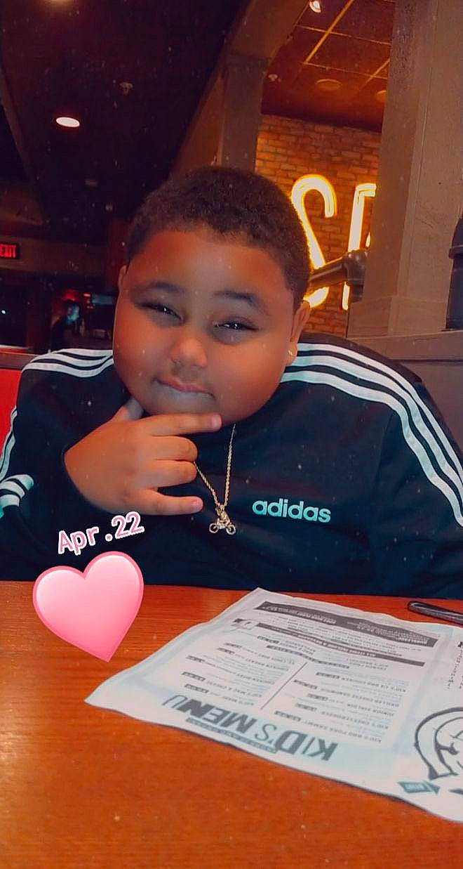 Jaydin is registered to the contest to win money with this photo: chair, child, event, font, fun, games, hairstyle, job, person, recreation, room, t_shirt, table, thumb