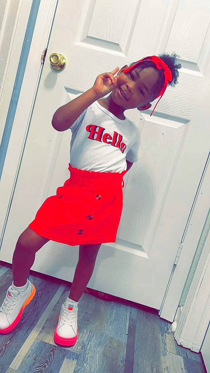 Macy Rogers is registered to the contest to win money with this photo: electric_blue, eyewear, face, happy, human_leg, joint, joy, knee, leisure, magenta, person, shoe, shorts, sleeve, sneakers, sports_uniform, sportswear, standing, sunglasses, t_shirt