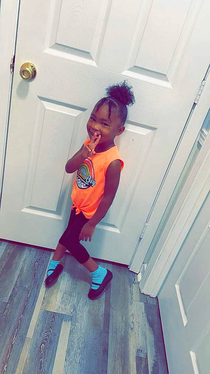 Macy Rogers joined the competition — help win amazing prizes! child, door, electric_blue, fashion_design, flooring, fun, happy, human_leg, leg, magenta, pattern, person, room, sandal, shoe, smile, sneakers, t_shirt, thigh, toddler