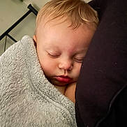 Anastasia is registered to the contest to win money with this photo: baby, blanket, child, closeup, comfort, cozy, cushion, cute, face, head, indoor, infant, nap, peaceful, portrait, rest, skin, sleeping, soft, young