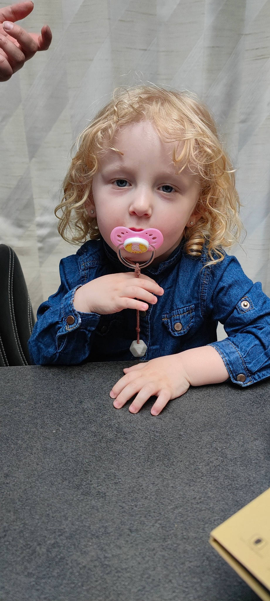 Siloé participe au concours pour gagner de l'argent avec cette photo : baby, baby_toddler_clothing, biting, cheek, child, clothing, dress, finger, fun, gesture, happy, iris, lip, mouth, nail, nose, outerwear, person, skin, sleeve