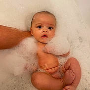 Oakley is registered to the contest to win money with this photo: baby, bath, bubbles, foam, water, infant, child, skin, arm, foot, toes, hand, relaxation, cleaning, bathroom, cute, young, sitting, support, person