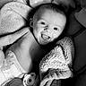 Alora joined the competition — help win amazing prizes! baby, infant, smiling, blanket, pacifier, diaper, lying_down, soft_texture, cute, happy, child, face, portrait, indoors, monochrome, newborn, cozy, comfort, resting, young