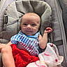 baby, infant, smile, face, blanket, bib, red_skirt, baby_seat, cushion, clothing, foot, hand, cute, portrait, indoor, soft_toy, comfort, happy, newborn, resting