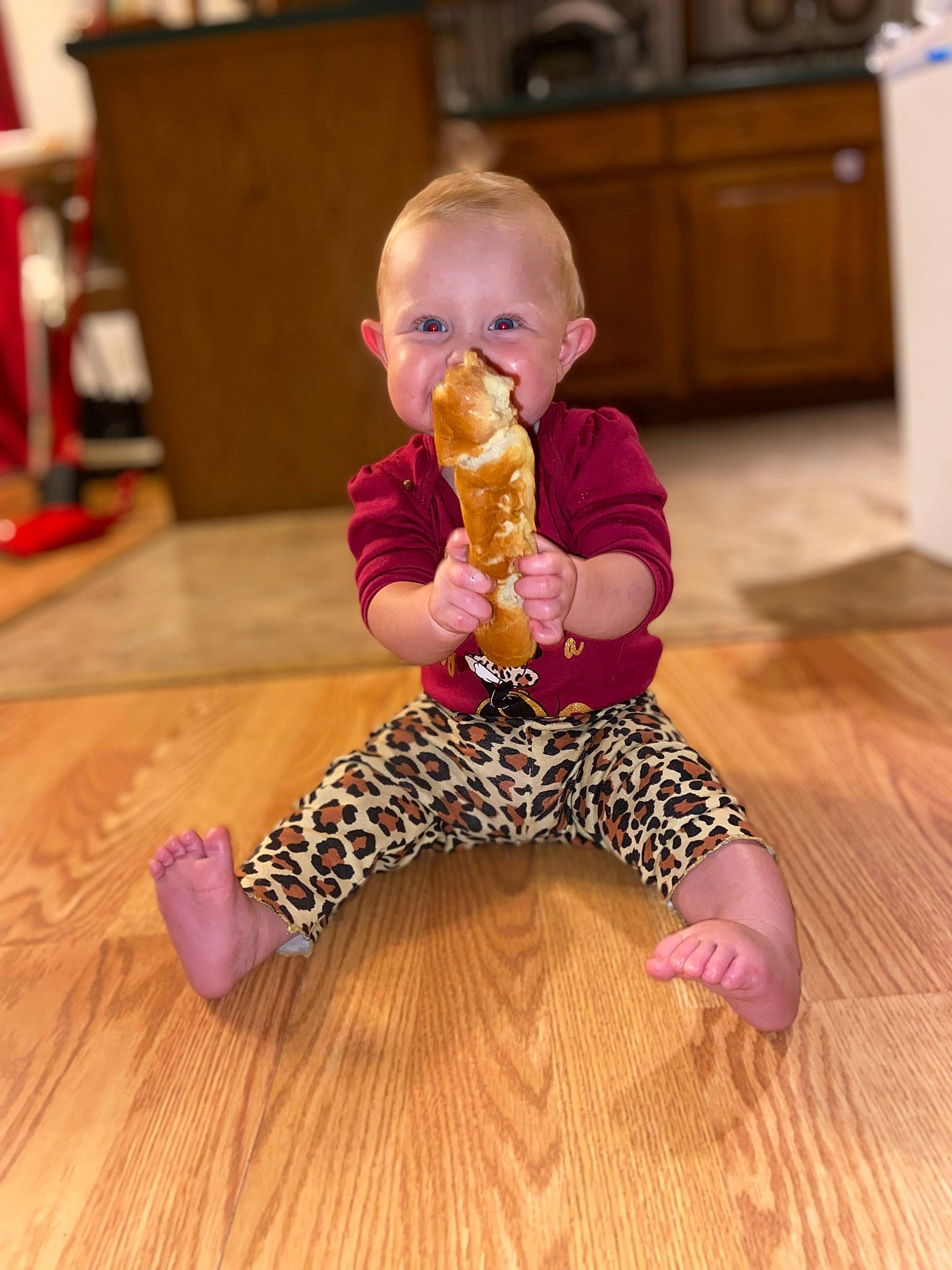 Daisy is registered to the contest to win money with this photo: baby, baby_toddler_clothing, cabinetry, child, comfort, face, floor, flooring, fun, hardwood, head, joint, laminate_flooring, person, skin, sleeve, thigh, toddler, varnish, wood