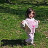 Valentina joined the competition — help win amazing prizes! child, toddler, grass, outdoor, sunlight, jacket, pink_clothing, shoes, smile, happy, nature, tree, shadow, playful, young_child, person, daylight, casual_clothing, cute, standing