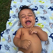 Haelo joined the competition — help win amazing prizes! baby, infant, laughing, smiling, diaper, blanket, dinosaur_pattern, outdoor, grass, happy, cute, child, toddler, skin, bare_chest, playful, joyful, portrait, infancy, nature