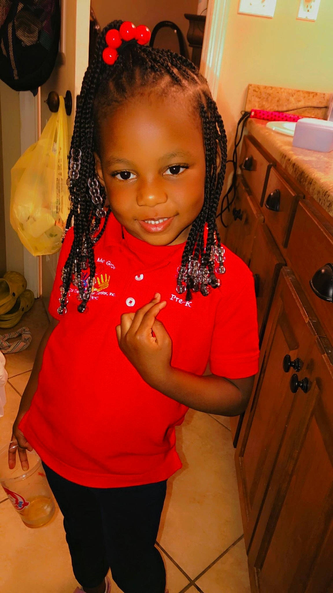 Jakaylyn is registered to the contest to win money with this photo: black_hair, cabinetry, child, chin, drawer, elbow, event, eyebrow, face, fashion_design, fun, happy, head, human_leg, jewellery, joy, long_hair, person, skin, smile