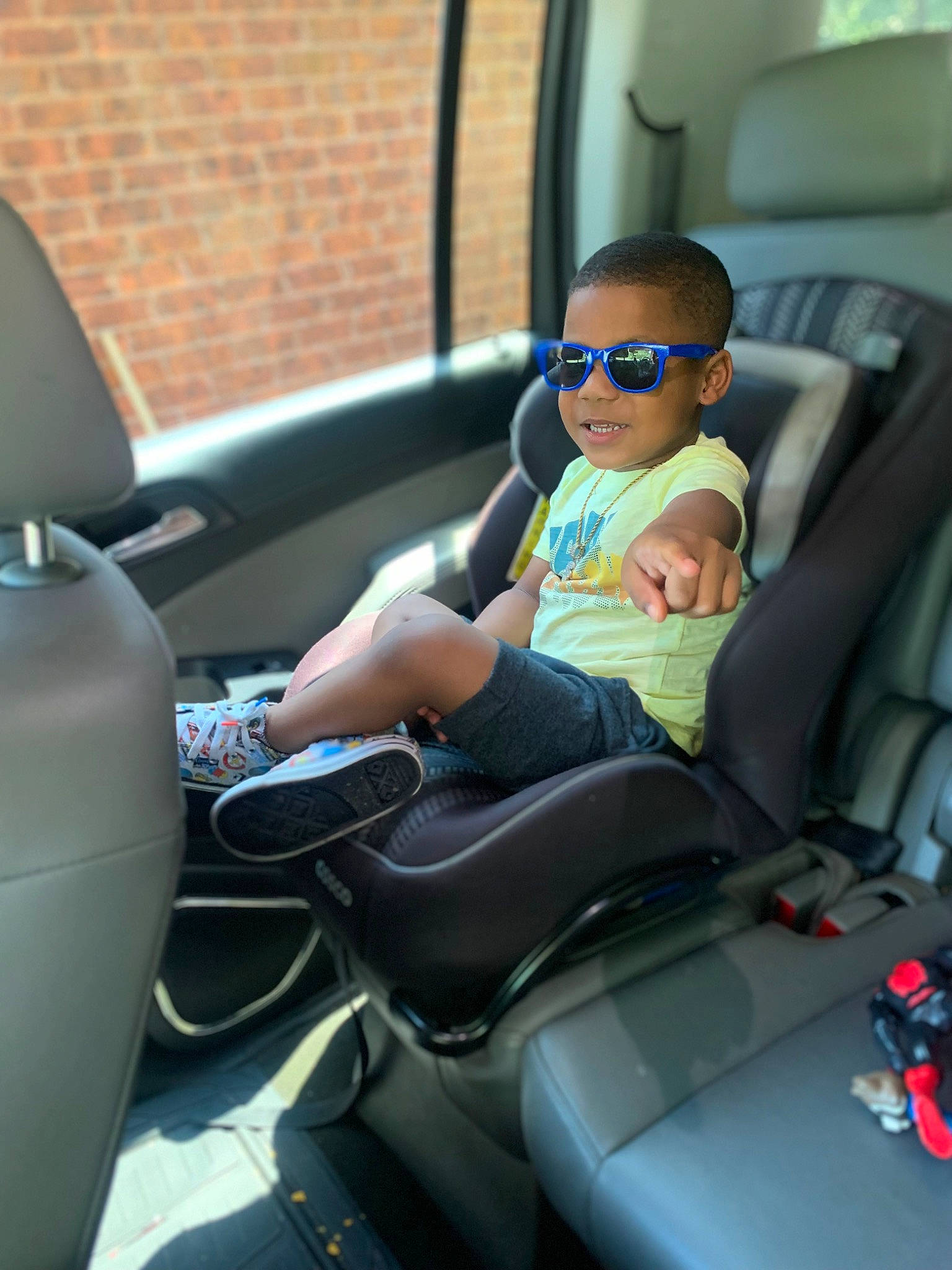 Fre Alund joined the competition — help win amazing prizes! automotive_design, automotive_exterior, car, car_seat, car_seat_cover, comfort, eyewear, glasses, goggles, head_restraint, mode_of_transport, motor_vehicle, person, smile, steering_part, steering_wheel, sunglasses, toddler, vehicle, vehicle_door