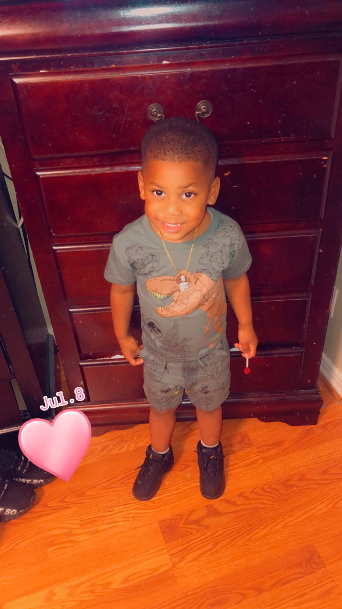 Fre Alund joined the competition — help win amazing prizes! baby_toddler_clothing, balloon, cheek, child, floor, flooring, fun, hardwood, human_leg, joy, magenta, material_property, person, shorts, sitting, smile, standing, t_shirt, thigh, toddler