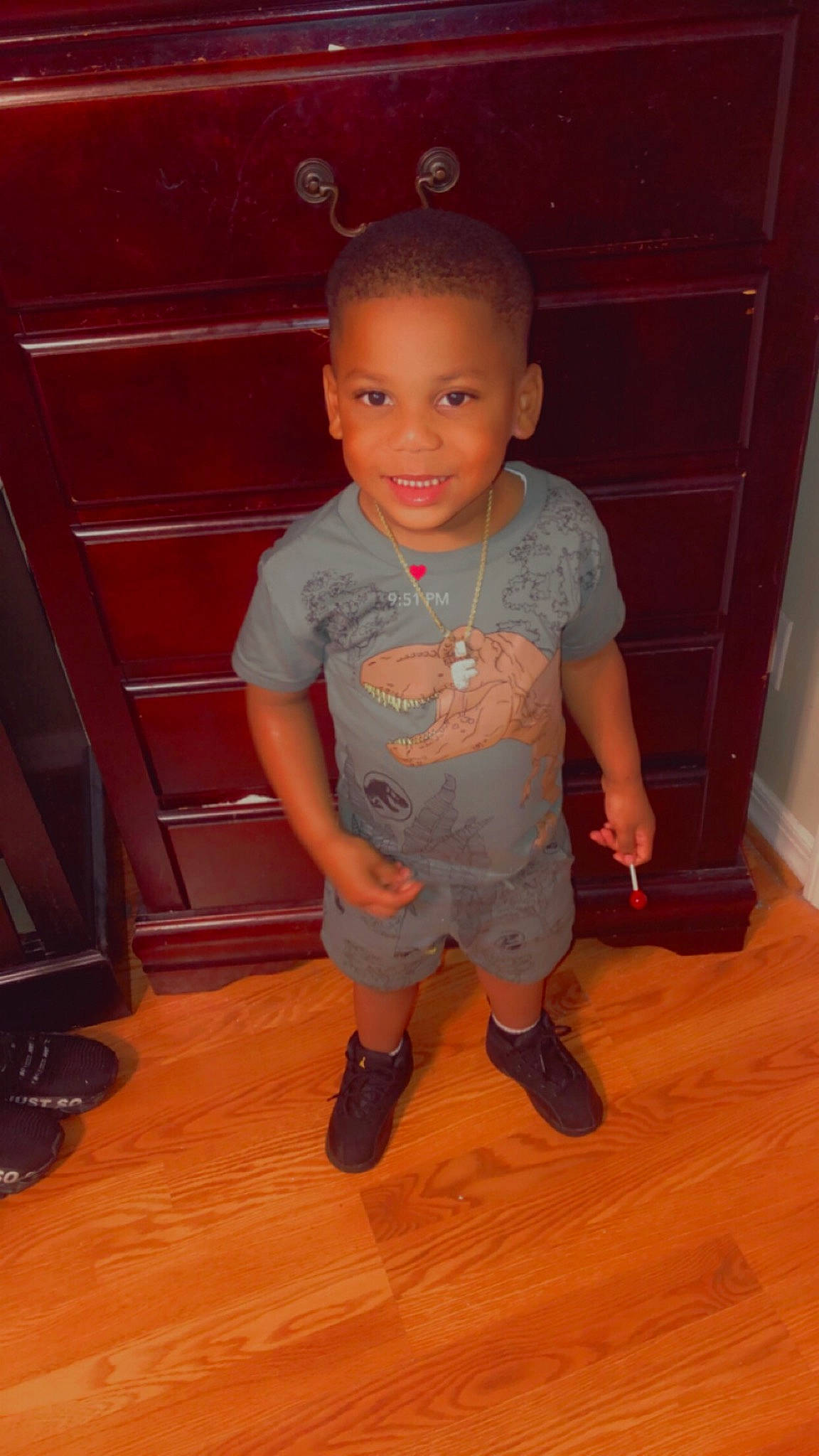 Fre Alund is registered to the contest to win money with this photo: baby_toddler_clothing, child, floor, flooring, foot, fun, hardwood, head, human_leg, joy, laminate_flooring, person, shorts, skin, sleeve, smile, t_shirt, toddler, varnish, wood