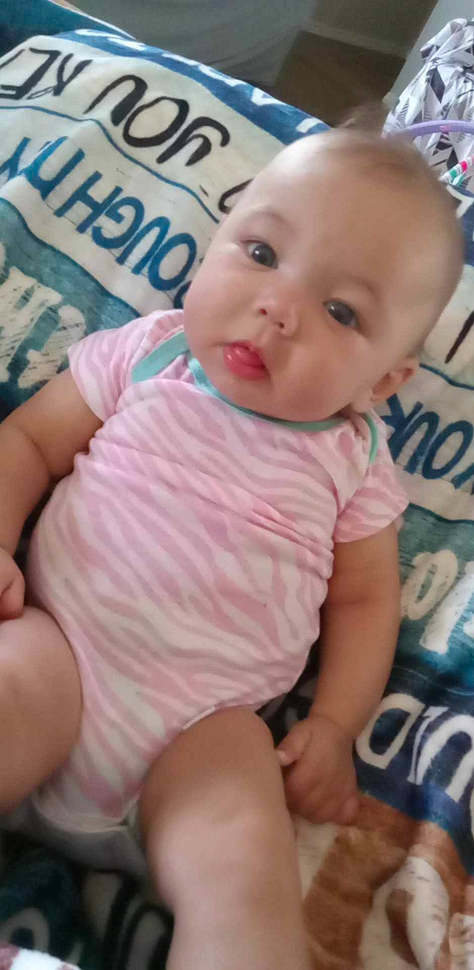 Kiara joined the competition — help win amazing prizes! abdomen, baby, baby_toddler_clothing, beauty, cheek, child, comfort, eyelash, happy, human_leg, pattern, person, pink, sitting, skin, sleeve, smile, stomach, thigh, thumb